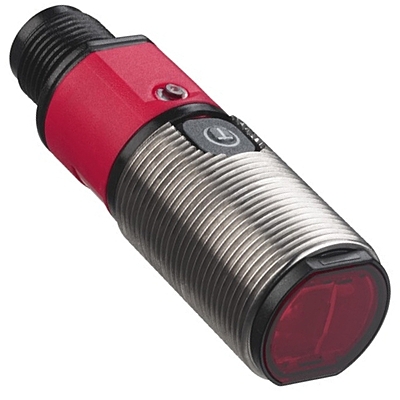 Close‑up of Leuze FT328 sensor with M12 connector and teach‑in button